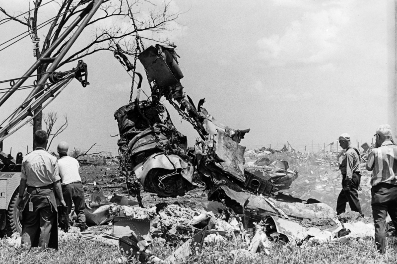 FILE--Investigators, in an attempt to determine the cause of a DC-8 crash, haul one of the engines from the main crater during cleanup on July 7, 1970. (THE CANADIAN PRESS / STF)