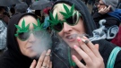 Brenna Richardson and Sam Buchan, right, of Surrey, B.C. smoke marijuana outside the Vancouver Art Gallery in downtown Vancouver, Tuesday, April 20, 2010. The event is to promote the use of marijuana in Canada. THE CANADIAN PRESS/Jonathan Hayward