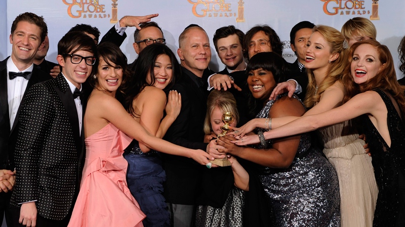 The cast and crew of 'Glee,' pose with the award they won for Best Television Series - Comedy Or Musical at the Golden Globe Awards in Beverly Hills, Calif., Jan. 16, 2011. (AP / Mark J. Terrill)