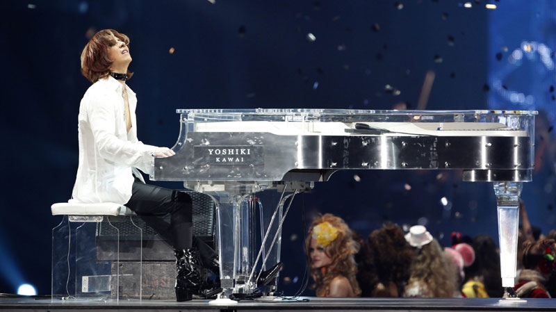 In this March 6, 2011 photo, Yoshiki, a member of Japanese heavy metal band X Japan, performs during the Asia Girls Explosion fashion event in Tokyo. (AP Photo/Shizuo Kambayashi, File)