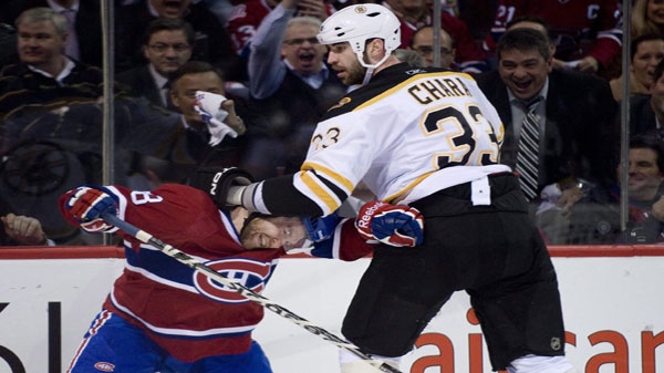 Boston Bruins' Zdeno Chara, right, roughs up Montreal Canadiens' David Desharnais during first period Game 4 NHL Stanley Cup playoff hockey action in Montreal, Thursday, April 21, 2011. THE CANADIAN PRESS/Graham Hughes