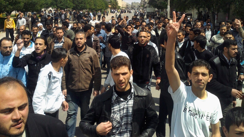 Syrian anti-government protesters gesture as they demonstrate following Friday prayers in the central city of Homs, Syria, Friday, April 22, 2011. (AP Photo)