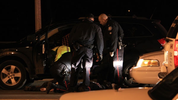 A man is treated for stab wounds near Las Brisas, a bar at Weston and Sheppard, which was the scene of a early morning triple on Friday, April 22, 2011.