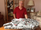 Self-proclaimed "Lego fanatic" John St-Onge poses with his set depicting the Millenium Falcon from Star Wars in Windsor, Ont., on Tuesday, July 9, 2013. (Sacha Long / CTV Windsor)