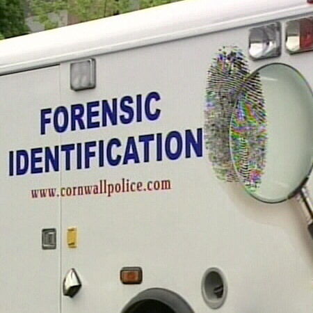 The forensic unit of the Cornwall police investigates at an alternative high school in Cornwall, Ont., after an alleged stabbing left one teen dead, Monday, May 12, 2008.