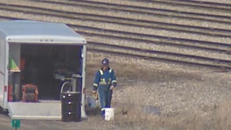 A worker is on the scene of a toxic fuel spill that one whistleblower says was 'ignored' by CP Rail management.