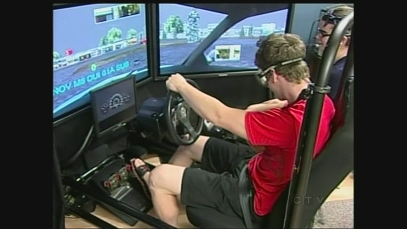 Students try a drunk driving simulator at a Drivewise class on Wednesday, July 10, 2013.