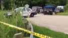 Police investigate a body found on the Grand River Trail in Kitchener on Wednesday, July 10, 2013. (David Imrie / CTV Kitchener)