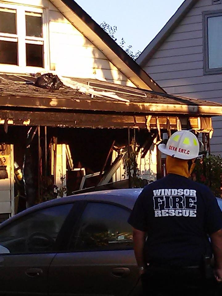 Windsor fire officials investigate a house fire on Hickory Road in Windsor, Ont., on Friday, July 12, 2013. (Arms Bumanlag / AM800)