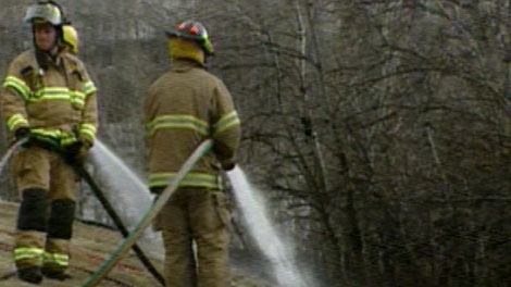 Fire crews tackle a grass fire in the River Valley on Monday, April 25, 2011.