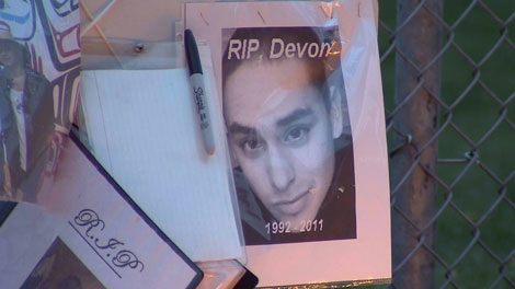 Friends set up a memorial to Devon Allaire-Bell, a 19-year-old stabbed outside a Surrey high school. April 25, 2011. (CTV)