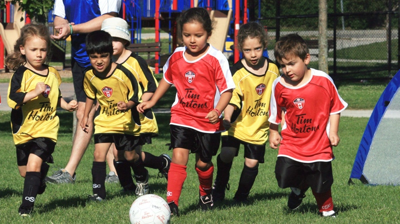 Children play in a soccer league in Oakville, Ont., on July 3, 2010. (Richard Buchan / THE CANADIAN PRESS)