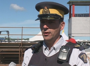 RCMP Sgt. Craig Cleary speaks to media at a news conference Sunday at the Craven Country Jamboree.