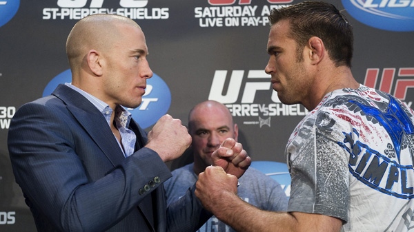 Georges St-Pierre, left, poses with Jake Shields during a UFC press conference in Toronto on Wednesday, April 27, 2011. Toronto will hold the largest venue in UFC history selling out with 55,000 fans at the Rogers Centre this coming Saturday. THE CANADIAN PRESS/Nathan Denette