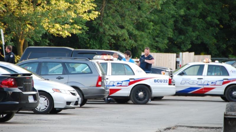 A 22-year-old man is taken into custody in connection to a triple homicide in Etobicoke, Tuesday, July 16, 2013. (Mike bettencourt / CTV Toronto)