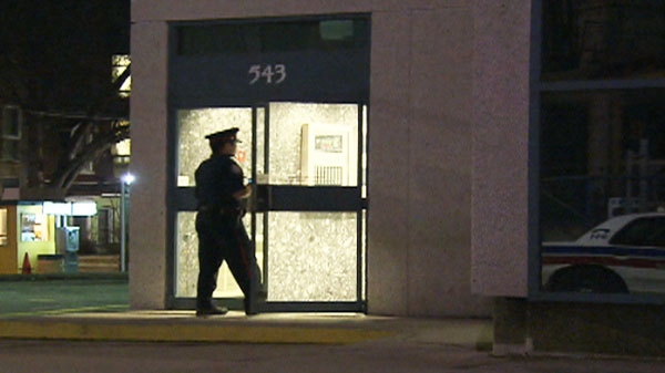 A police officer enters the building at 543 Richmond St. W after repairman was crushed in elevator doors on Thursday, April 28, 2011.