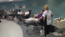 Peter Slykhuis and Alan Flewelling donate blood at a Canadian Blood Services clinic in Mississauga, Ont.
