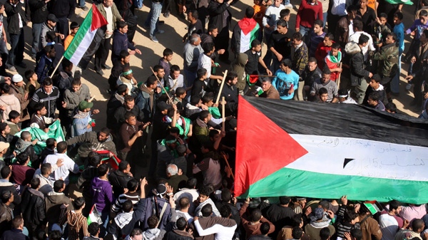 In this March 15, 2011 file photo, Palestinian supporters of the Hamas clash with youths waving Palestinian flags during a rally calling for political unity between Gaza's Hamas rulers and the Fatah in Gaza City. (AP Photo /Majed Hamdan)