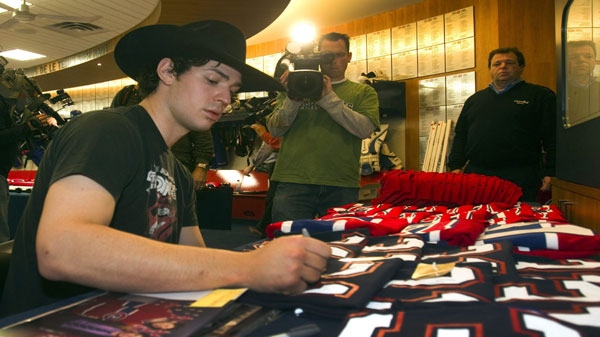 Montreal Canadiens goaltender Carey Price autographs souveniers at the end of season media availability Thursday, April 28, 2011 in Brossard, Que., after losing their NHL Stanley Cup playoff first round series to the Boston Bruins in seven gamesl.THE CANADIAN PRESS/Ryan Remiorz