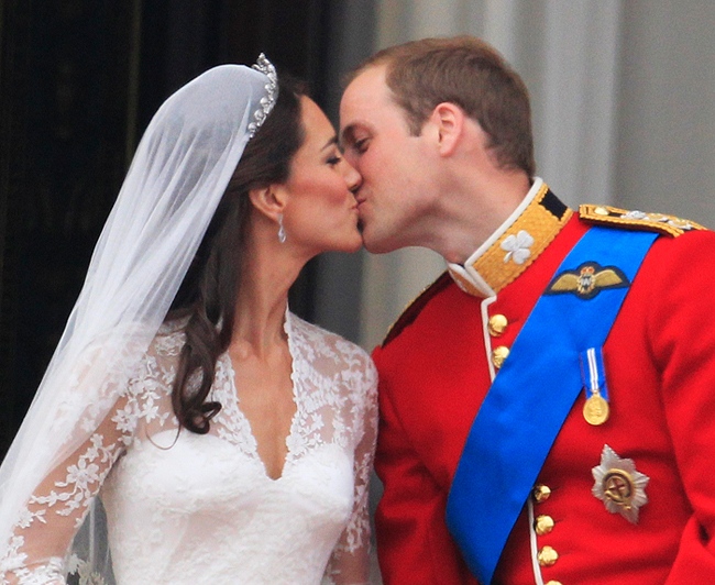 Prince William kisses his wife Kate, Duchess of Cambridge on the balcony of Buckingham Palace after the royal wedding in London Friday, April, 29, 2011. (AP / Matt Dunham)