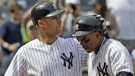 New York Yankees' Derek Jeter, left, greets teammate Curtis Granderson at the plate after Granderson hit a fifth-inning three-run home run off Toronto Blue Jays starting pitcher Jesse Litsch during a baseball game in New York, Sunday, May 1, 2011. (THE ASSOCIATED PRESS / Kathy Willens)