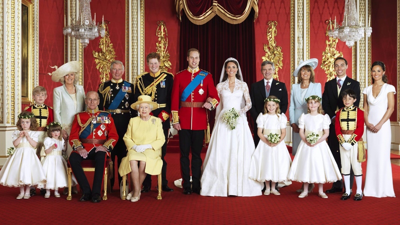 Prince William, centre left, and his wife Kate, Duchess of Cambridge, centre right, pose for a group photograph with, from back row left, Master Tom Pettifer, Camilla, Duchess of Cornwall, Prince Charles, Prince Harry, Michael Middleton, Carole Middleton, James Middleton, Philippa Middleton, and front row from left, Grace van Cutsem, Eliza Lopes, Prince Philip, Queen Elizabeth II, Margarita Armstrong-Jones, Lady Louise Windsor, and William Lowther-Pinkerton in the Throne Room at Buckingham Palace, following their wedding at Westminster Abbey, London, Friday, April 29, 2011. (Hugo Burnand / Clarence House)