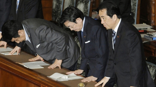 From right, Japanese Prime Minister Naoto Kan, Economic and Fiscal Policy Minister Kaoru Yosano and Chief Cabinet Secretary Yukio Edano, bow just after the supplementary budget bill for the fiscal 2011 year was approved, at Parliament's upper house in Tokyo Monday, May 2, 2011. (AP Photo/Kyodo News)