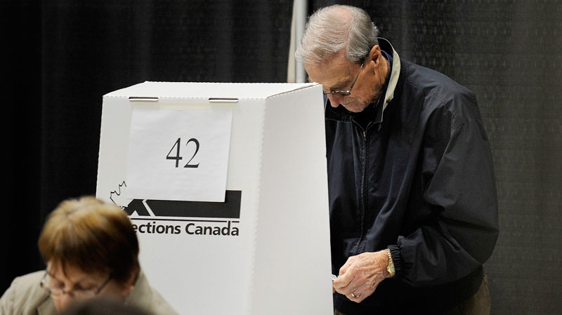 Voters take to the polls to cast their ballot in the federal election in Charlottetown, P.E.I. early Monday, May 2, 2011. (Nathan Rochford / THE CANADIAN PRESS)