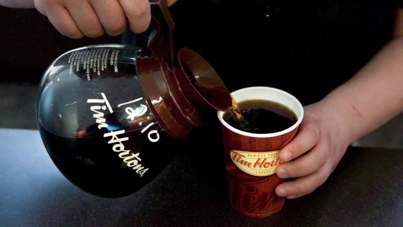 A cup of Tim Hortons coffee is poured in Toronto in this file 2010 photo. (Chris Young / THE CANADIAN PRESS)