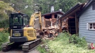 Crews demolish a home in Bracebridge that was damaged by flooding earlier this year. (Courtney Heels / CTV Barrie)