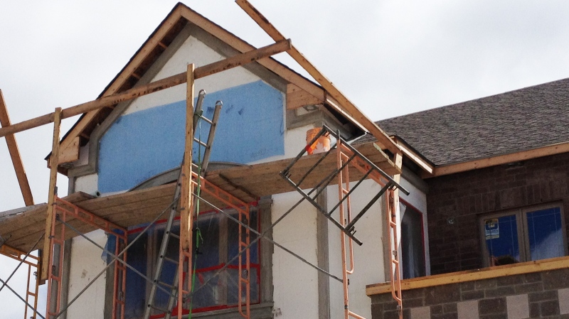 Scaffolding is seen on a house under construction in the Doon South area of Kitchener, Ont., on Wednesday, July 24, 2013. (Nadia Matos / CTV Kitchener)