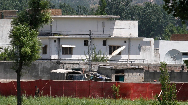 A Pakistani soldier stands near a compound where it is believed al-Qaida leader Osama bin Laden lived in Abbottabad, Pakistan, Monday, May 2, 2011. (AP / Anjum Naveed)