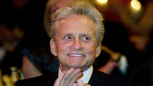Actor Michael Douglas talks with smiles as he attends the 17th annual McGill University Head and Neck Cancer fundraiser in Montreal, Tuesday, May 3, 2011.THE CANADIAN PRESS/Graham Hughes