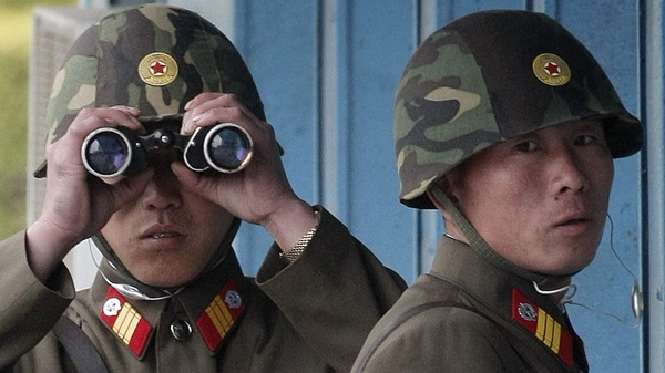 In this April 29, 2011 file photo, North Korean soldiers are seen at their broder post in the village of Panmunjom that separates the two Koreas since the Korean War. (AP Photo/Ahn Young-joon, Pool)