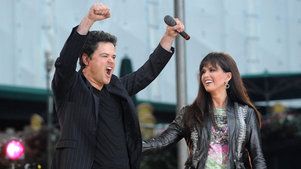 Singers Donnie and Marie Osmond perform in Bryant Park on ABC's "Good Morning America" show on Friday, Aug. 15, 2008, in New York.