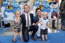 Neil Patrick Harris and David Burtka with twins Harper Grace Burtka-Harris, left, and Gideon Scott Burtka-Harris, right, arrive to the world premiere of ‘The Smurfs 2’ at the Regency Village Theatre in Los Angeles on Sunday, July 28, 2013. (John Shearer/Invision)