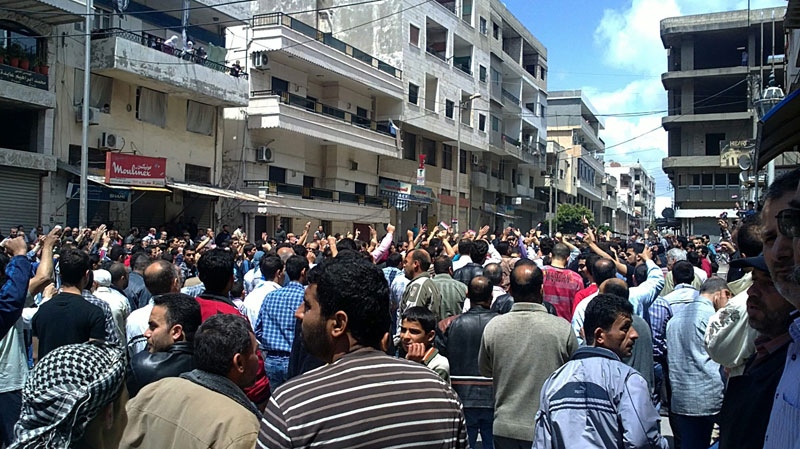 In this citizen journalism image made on a mobile phone and acquired by the AP, Syrian anti-government protesters shout slogans as they gather in the coastal town of Banias, Syria, Friday, May 6, 2011. (AP Photo)