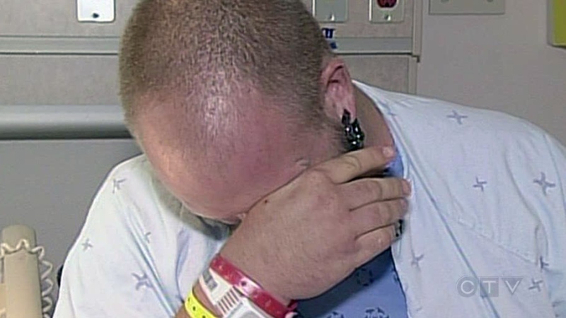Matthew Gunton breaks down as he describes being stabbed while recovering in hospital in London, Ont. on Tuesday, July 30, 2013.