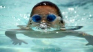 Tony Salazar, 6, emerges from the water as he demonstrates a swim stroke following a presentation on water safety by the Texas Department of Family and Child Protective Services Monday June 16, 2008 at the Grandview pool in El Paso, Texas. (El Paso Times, Victor Calzada)
