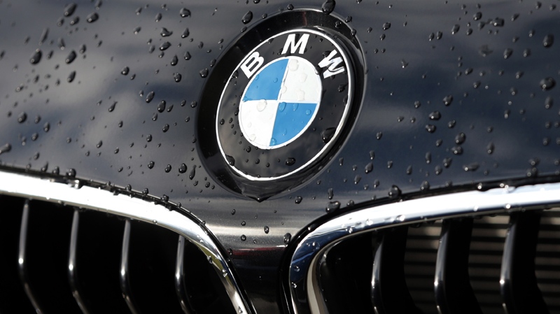 In this March 19, 2013 file photo the company logo of car manufacturer BMW is pictured on a car in Munich, Germany.  (AP / Matthias Schrader, File)