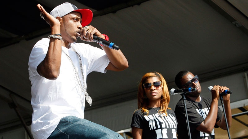 Mystikal, left, performs at the New Orleans Jazz and Heritage Festival in New Orleans, Saturday, May 7, 2011. (AP Photo/Patrick Semansky)