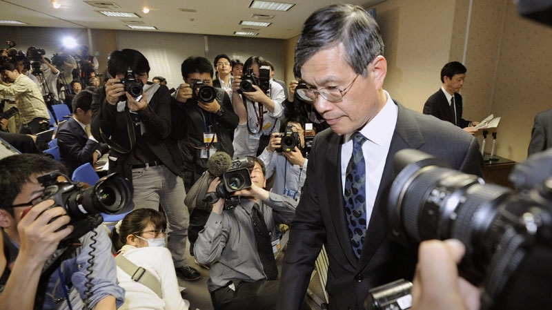 Chubu Electric Power Co. President Akihisa Mizuno, right, leaves a press conference where he announced it has agreed to the government's request to close its Hamaoka nuclear power plant, at the head office in Nagoya, central Japan, on Monday May 9, 2011. (AP / Kyodo News) 