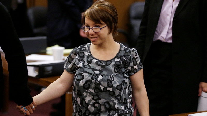 Michelle Knight leaves the courtroom after the sentencing phase for Ariel Castro Thursday, Aug. 1, 2013, in Cleveland. Knight, 32, was the first woman abducted Castro in 2002. (AP / Tony Dejak)