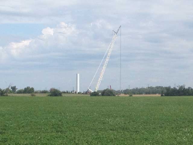 A crane was used to remove the fire-damaged parts of a wind turbine near Goderich, Ont. on Thursday, Aug. 2, 2013. (Scott Miller / CTV London)