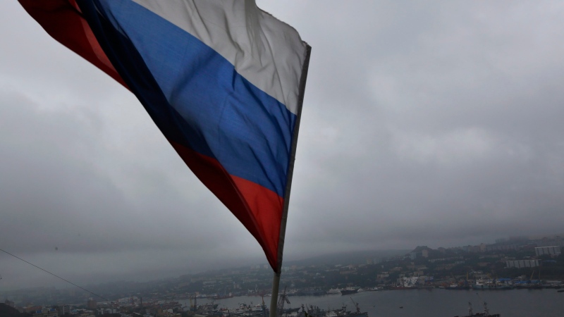 A Russian flag flies above the port in the eastern city of Vladivostok in this 2012 file photo. (AP Photo/Vincent Yu)