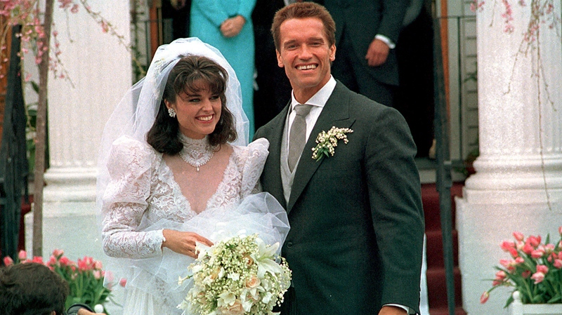 Arnold Schwarzenegger poses Maria Shriver following their wedding ceremony in Hyannis, Mass., April 25, 1986. (AP Photo)