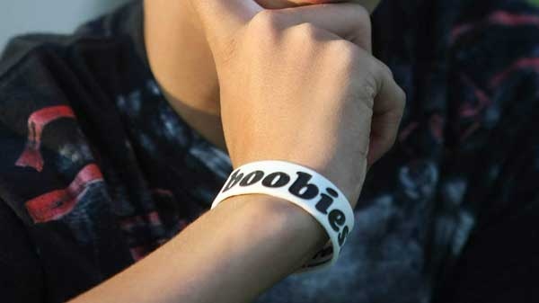 A student wears a "I (heart) boobies" bracelet, which is meant to raise breast cancer awareness. (THE ASSOCIATED PRESS / Laramie Boomerang, Andy Carpenean)
