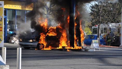 Flames engulf a van and a gas pump at an Ultramar gas station on Montreal Road, Tuesday, May 10, 2011. Credit: Pierre Chretien
