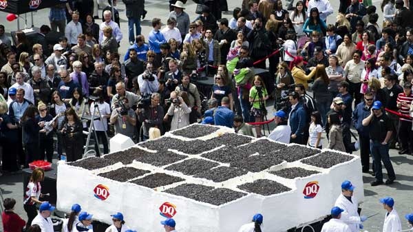 Dairy Queen workers mark the 30th year of making birthday ice cream cakes in Canada by building and setting the Guinness World Record for the world's largest ice cream cake, weighing in at 10,130.35-kilograms, in Toronto on Tuesday, May 10, 2011. (Nathan Denette /THE CANADIAN PRESS)