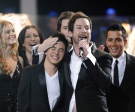 David Cook, centre, hugs fellow contestant, David Archuleta, centre left, after he was announced the winner of 'American Idol' as Kristy Lee Cook, left, Carly Smithson, second left, Michael Johns, and David Hernandez, right look on during the finale at the Nokia Theatre in Los Angeles, Wednesday, May 21, 2008.  (AP / Kevork Djansezian)